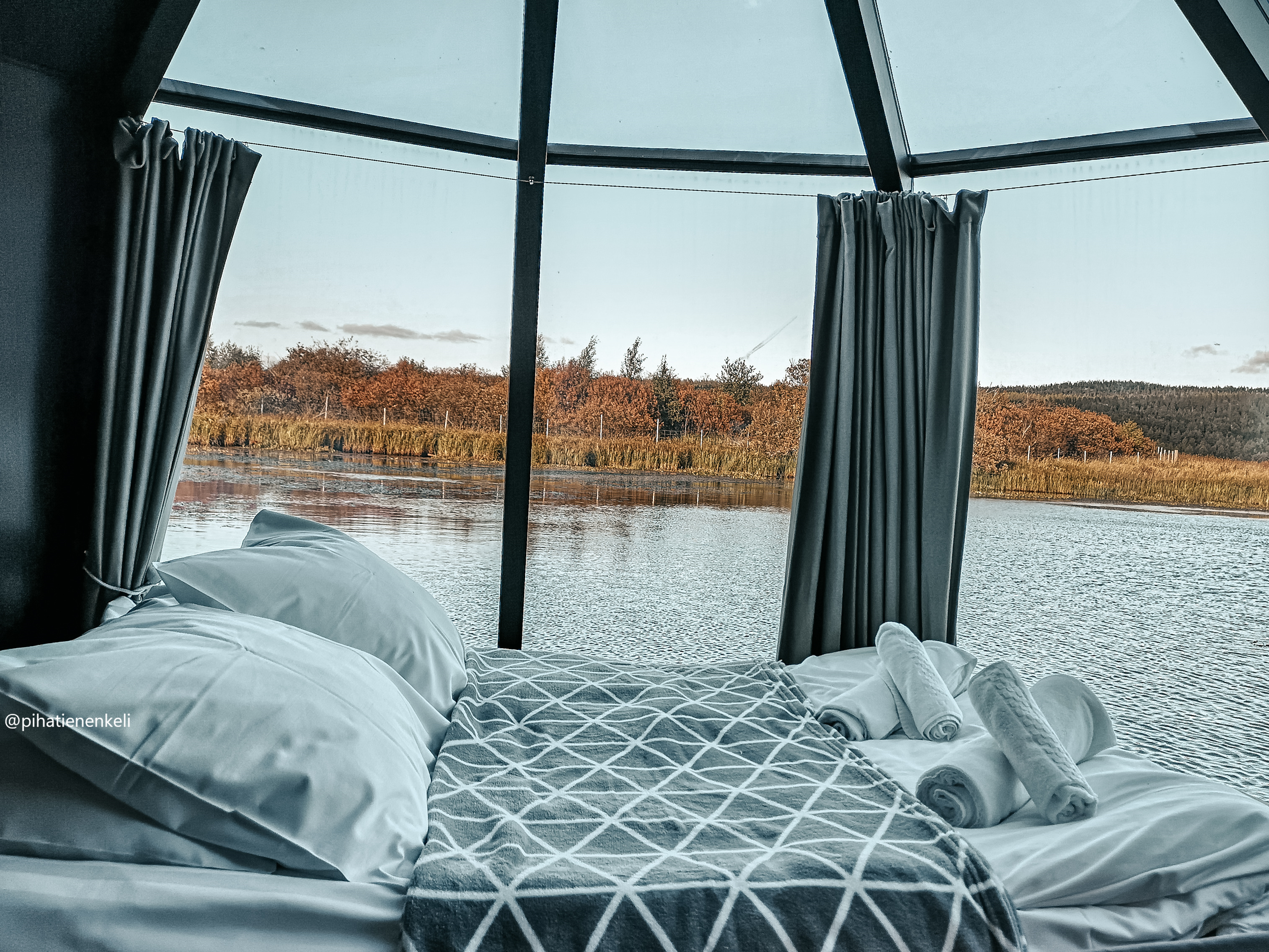 Glass-roofed cabin under the midnight sun at Ollero Eco Lodge near Rovaniemi in Finnish Lapland